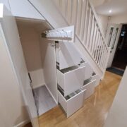 CUSTOM UNDER-STAIR STORAGE WITH LED-LIT STAIRCASE