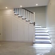 CUSTOM UNDER-STAIR STORAGE WITH LED-LIT STAIRCASE