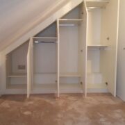 CUSTOM UNDER-STAIR STORAGE WITH LED-LIT STAIRCASE