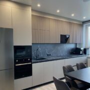 Minimalist Matte Kitchen with Textured Upper Cabinets